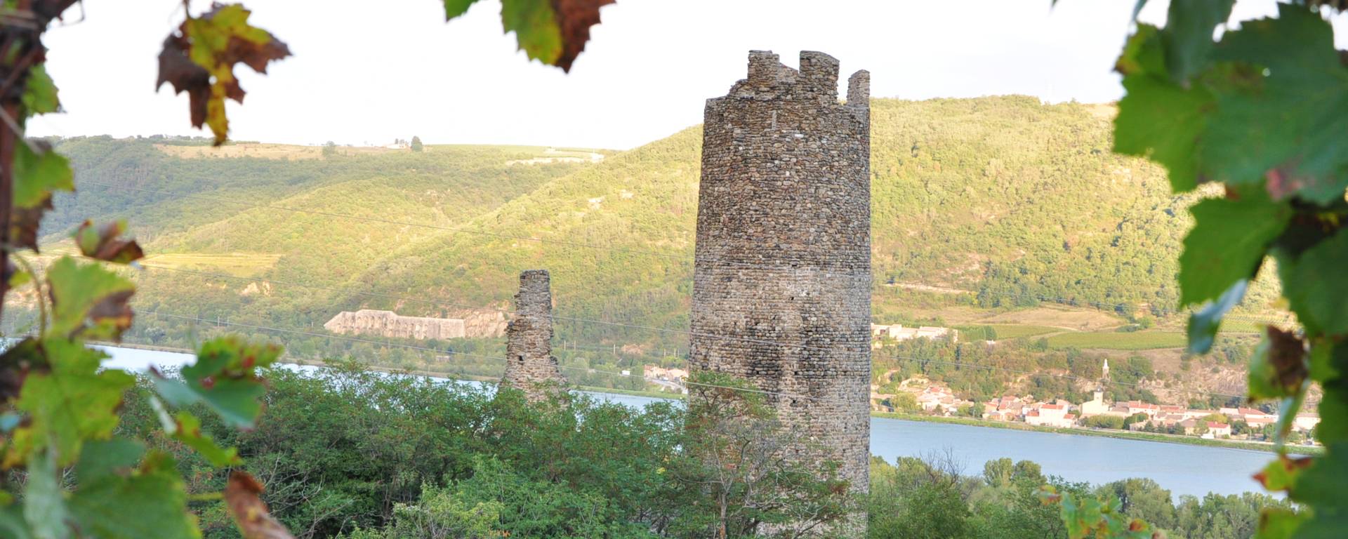 Tower of the village of Arras, remains of the castle and the Rhône River in the Ardèche