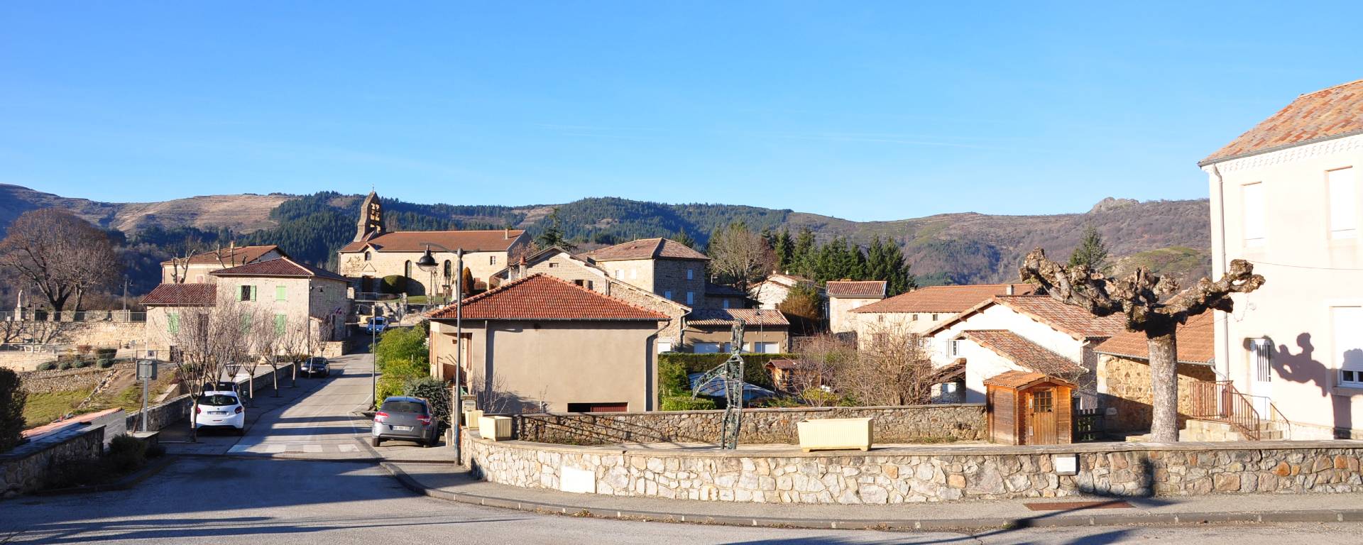 View of the street in the village of Accons in Ardèche leading to the church